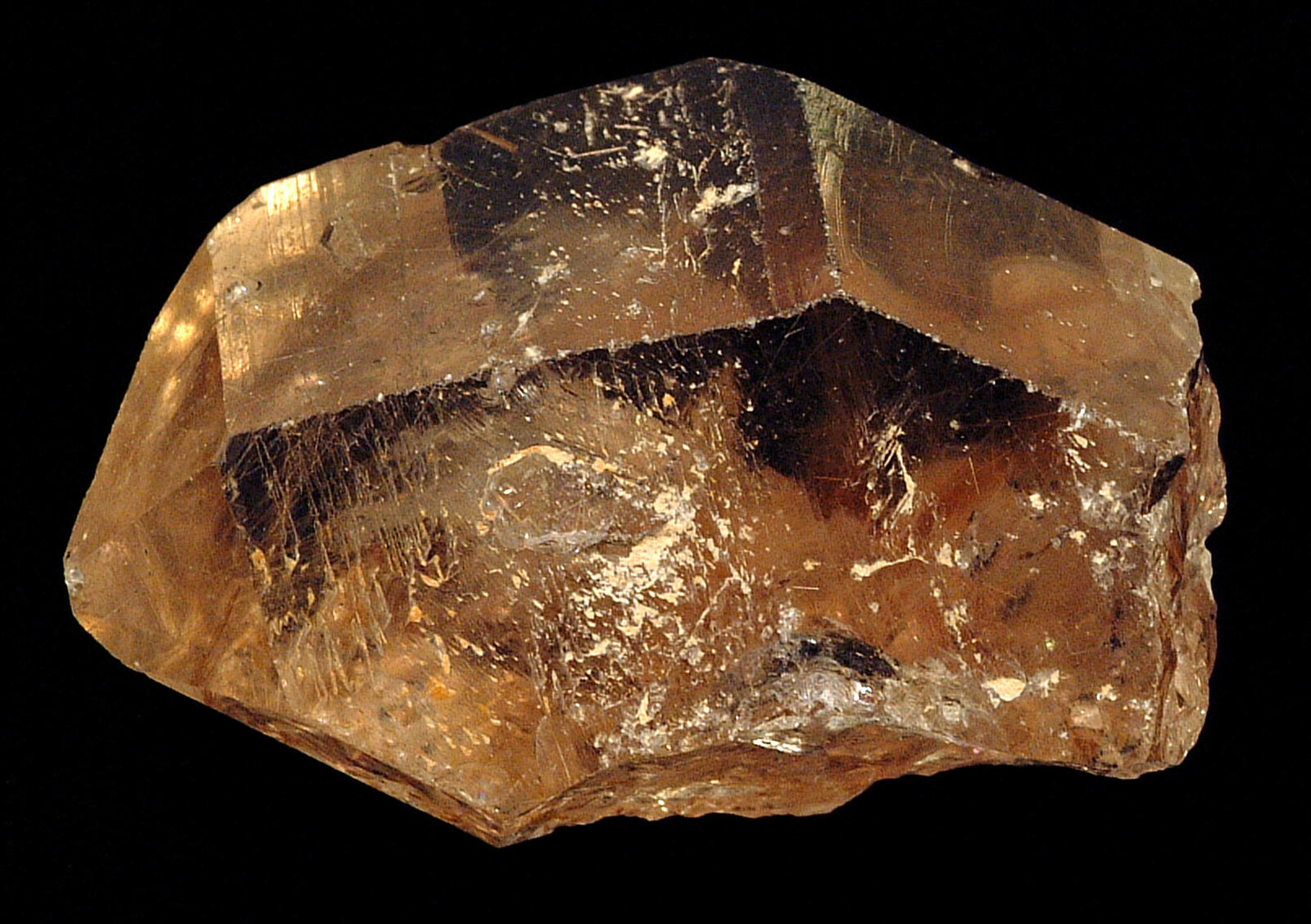 Clear-to-milky quartz crystal with crisp highlights on its flat faces.